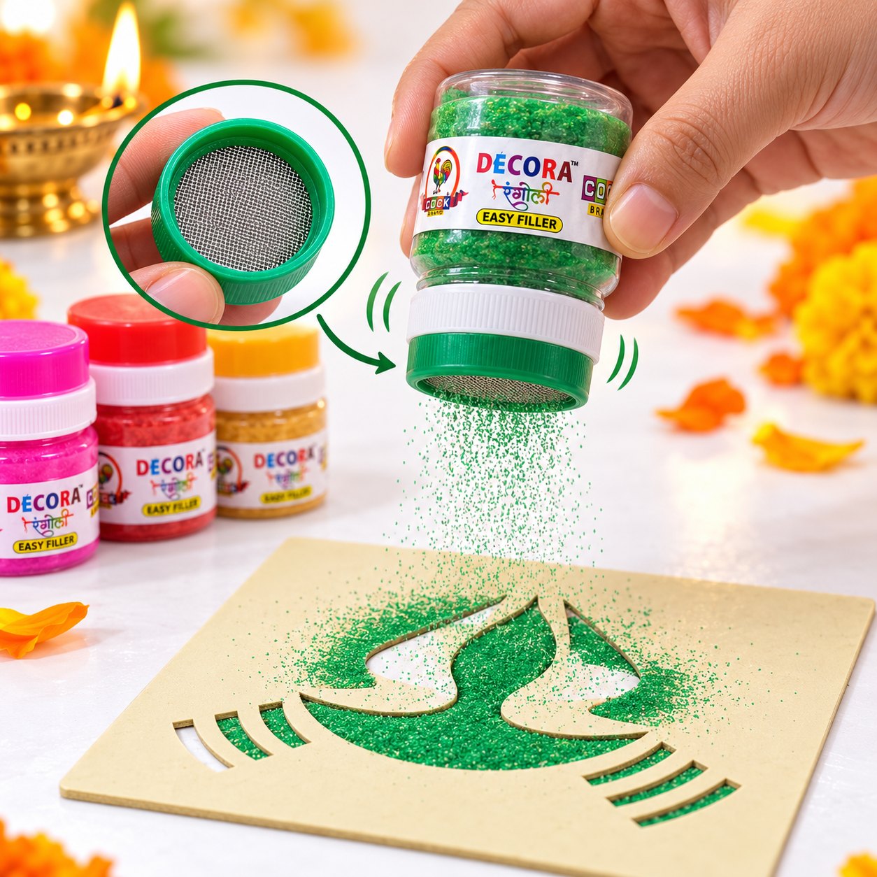Close-up of the Easy Filler mesh lid: a gentle tap sprinkles green rangoli colour evenly into a diya stencil